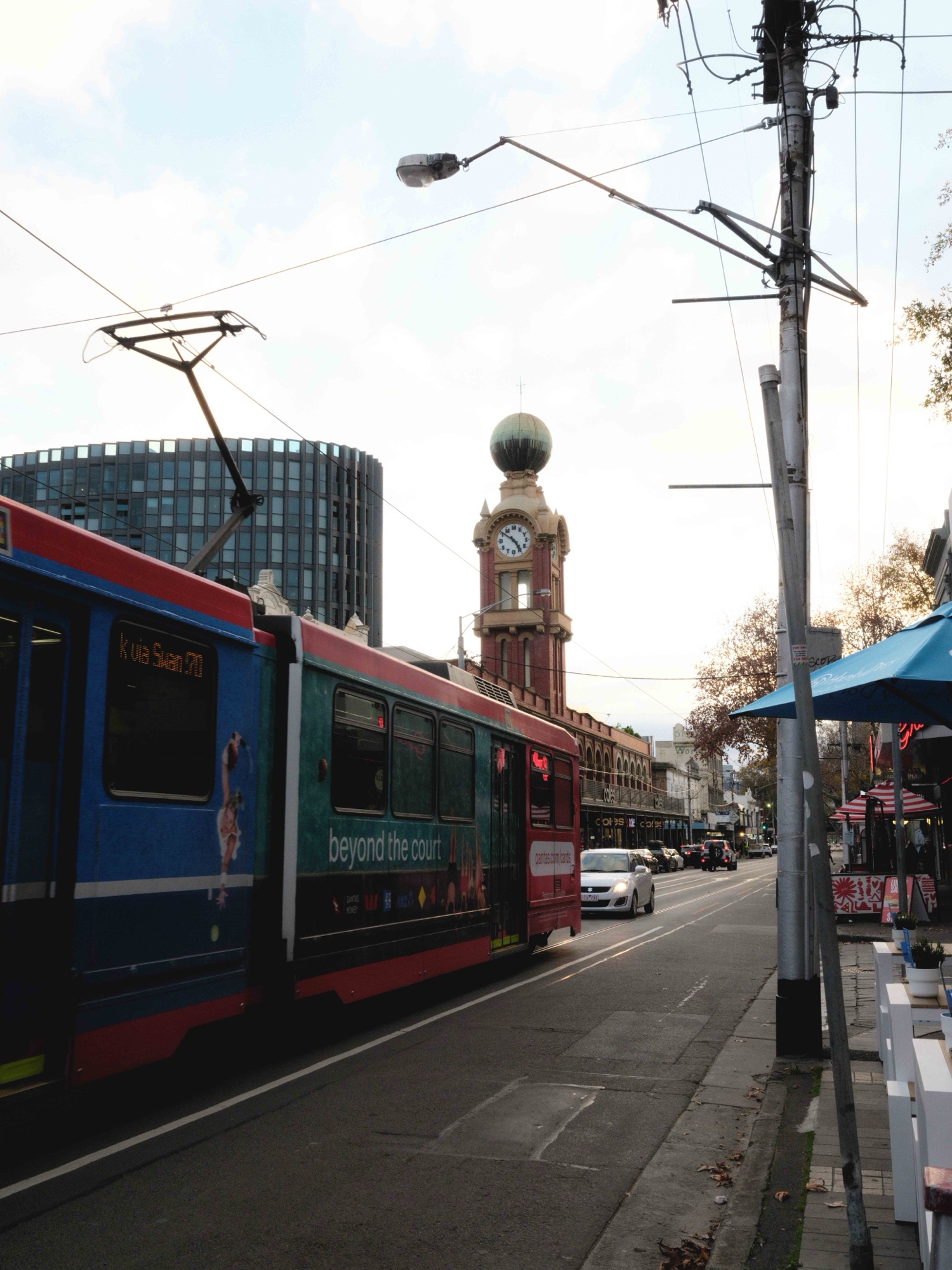 A route 70 tram passing the Dimmeys clock tower on Swan Street, Richmond